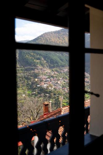 a view of a mountain from a window at Dandy Villas Metsovo - Avo - Fireplace - Up to 6 in Metsovo