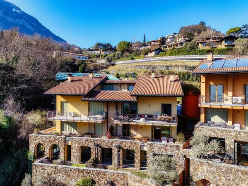 a view of a house with mountains in the background at Bella Vita - by MyHomeInComo in Menaggio