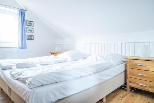 Postel nebo postele na pokoji v ubytování Haus Alte Bäckerei - Boddenblick