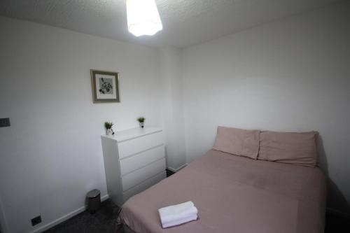 Ένα ή περισσότερα κρεβάτια σε δωμάτιο στο Wooburn Place
