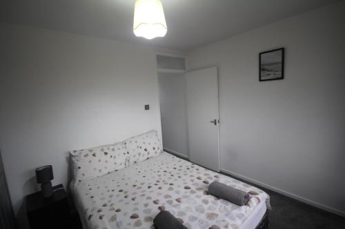 Ένα ή περισσότερα κρεβάτια σε δωμάτιο στο Wooburn Place