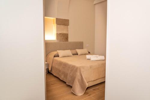 Ένα ή περισσότερα κρεβάτια σε δωμάτιο στο B&B Romagnosi 14