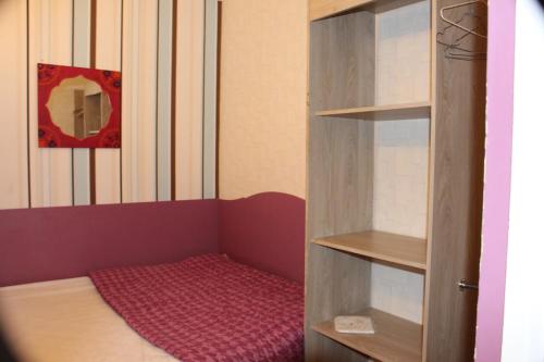 a small room with a bed in a closet at Bel appartement au pied des pistes 9 personnes in Saint-Lary-Soulan