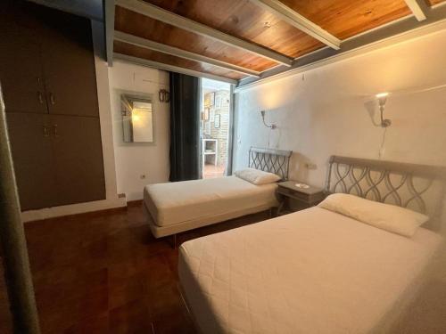 Postel nebo postele na pokoji v ubytování Casa con Encanto en Monachil