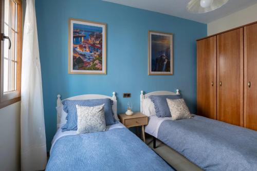 Ένα ή περισσότερα κρεβάτια σε δωμάτιο στο Bitácora - Apartamento con aparcamiento en Cudillero - LICENCIA VUT 341 AS