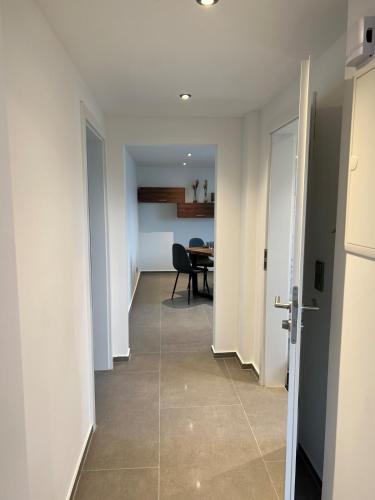 a hallway with a dining room and a table at City Apartment 2 in Euskirchen