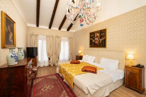 Postel nebo postele na pokoji v ubytování Relais Alberti