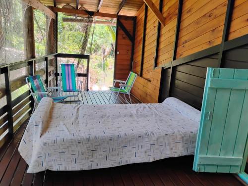 Giường trong phòng chung tại casa entre praias