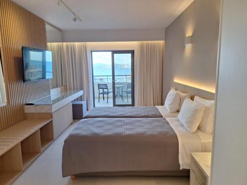 Postel nebo postele na pokoji v ubytování Kos Palace