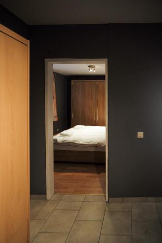 a bedroom with a bed in a black wall at City Apartment 1 in Euskirchen