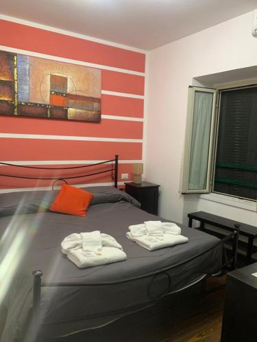 a bedroom with a bed with two towels on it at B&B La Cupella in Monterotondo
