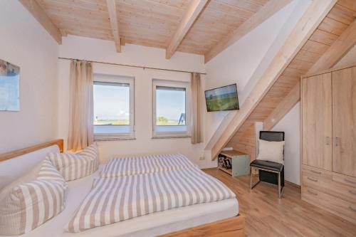 Postel nebo postele na pokoji v ubytování Reusenhof Am Haff