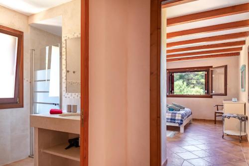 a bathroom with a sink and a mirror at Finca Estrella in Artá