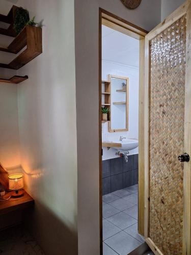 a bathroom with a sink and a mirror at Secret spot 3 in El Nido