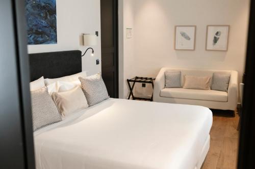 Postel nebo postele na pokoji v ubytování Hotel Boutique Sidonia