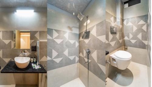 a bathroom with a sink and a toilet at Treebo Neel Orchid in Ujjain