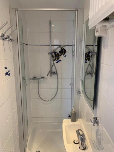 a bathroom with a shower and a sink at Ruhe auf Borkum in Borkum