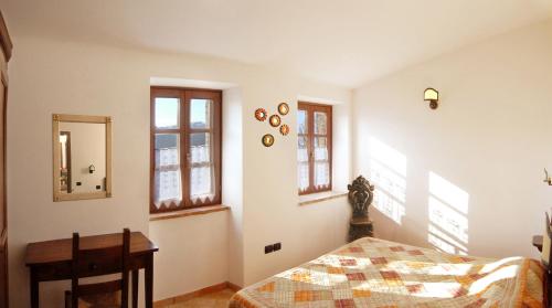 Postel nebo postele na pokoji v ubytování Agriturismo Ampugnano