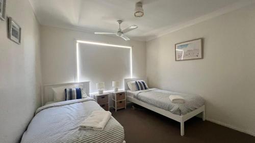 Ένα ή περισσότερα κρεβάτια σε δωμάτιο στο Bougainvillea