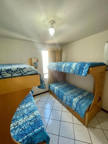 Ένα ή περισσότερα κρεβάτια σε δωμάτιο στο Apt Centro Guarapari - Ótima Localização