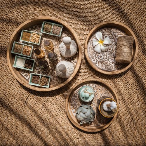 a group of plates with shells on a table at The Ocean Resort by Fusion Quy Nhon in Quy Nhon