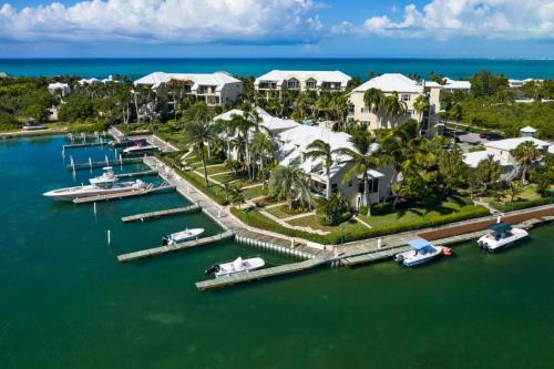 an aerial view of a resort with boats in the water at 2 Bdrm Garden Marina View at The Yacht Club C4 in Providenciales