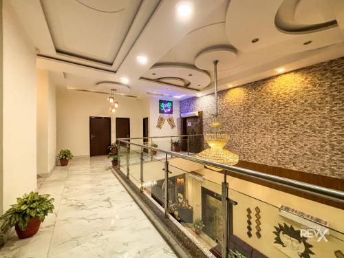 a lobby of a hotel with a stone wall at The Neeraj River Forest Resort Ayurvedic Wellness Center in Rishīkesh