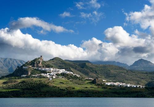 a town on a hill next to a body of water at Al Lago in Zahara de la Sierra