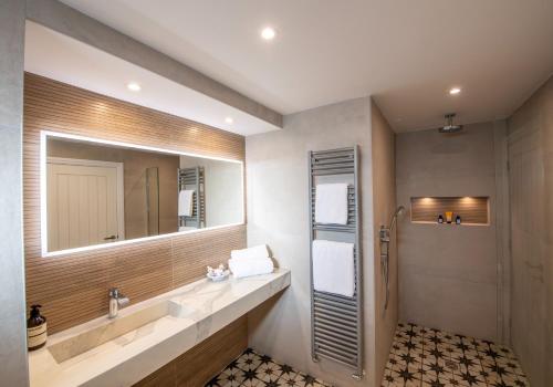 a bathroom with a sink and a mirror at Scallop Lodge Lytham in Lytham St Annes