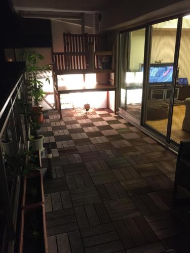 a screened in porch with a view of the patio at The Rareage Hakone-Yumoto by Mloc in Hakone