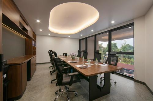 a conference room with a long table and chairs at Hanoi Riverview Boutique Hotel & Apartment in Hanoi