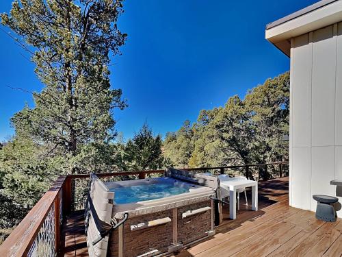 a hot tub on the deck of a house at Casa Blanca in Ruidoso