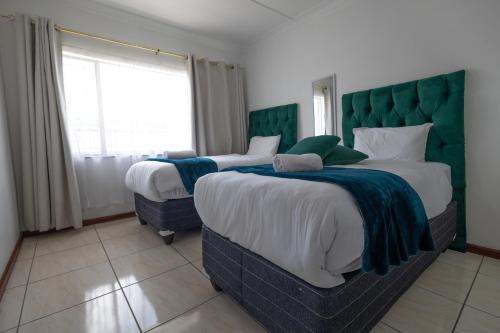 Ένα ή περισσότερα κρεβάτια σε δωμάτιο στο Safi Luxury Self-Catering Suite 8