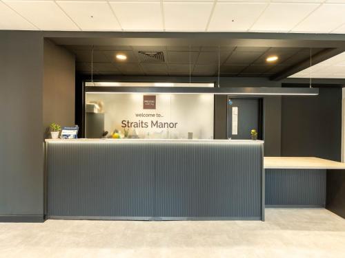 an office with a sign that reads sticks mirror at For Students Only Straits Manor in Sheffield in Sheffield