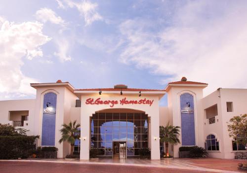 a building with a happy turkey sign on it at Xperience St. George Sharm El Sheikh in Sharm El Sheikh