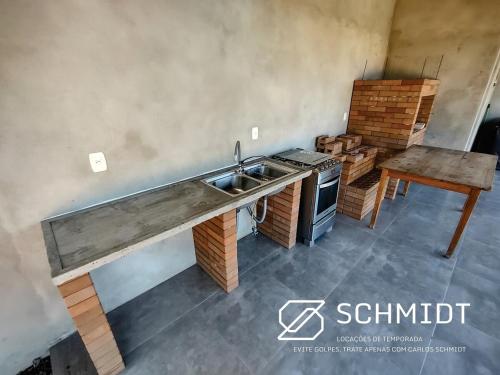 Η κουζίνα ή μικρή κουζίνα στο Casa Arroio do Sal