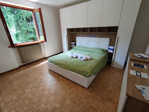 Postel nebo postele na pokoji v ubytování Esino Sweet Home by Holiday World
