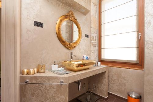 a bathroom with a sink and a mirror at Apartment Lux Rovinj in Rovinj