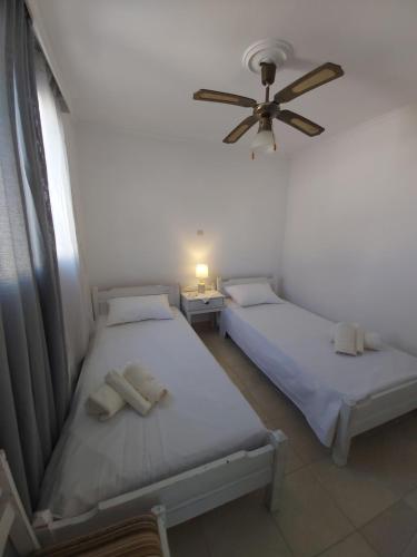 Postel nebo postele na pokoji v ubytování Dandelion Paros Apartments III-IV