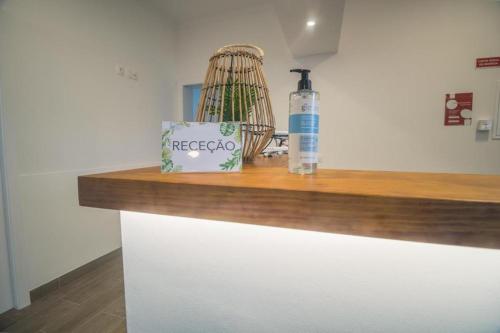 a bottle of alcohol sitting on top of a counter at Vila Rosario in Ponta Delgada