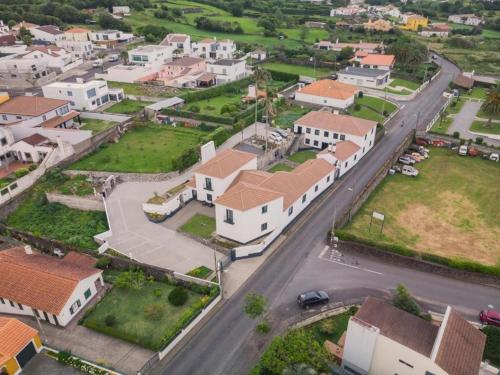 an aerial view of a town with houses and a street at Vila Rosario in Ponta Delgada
