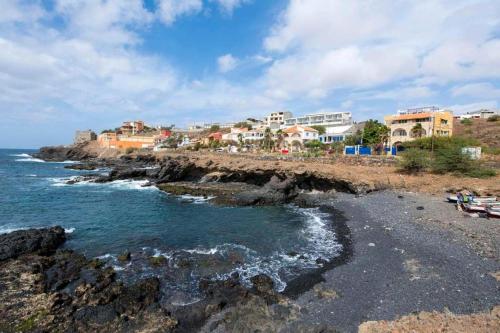 a view of a beach with houses and the ocean at brISA in Praia