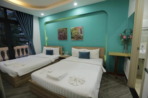 Кровать или кровати в номере Teddy 108 Homestay & Cafe - 3 stars - Grand World Phu Quoc