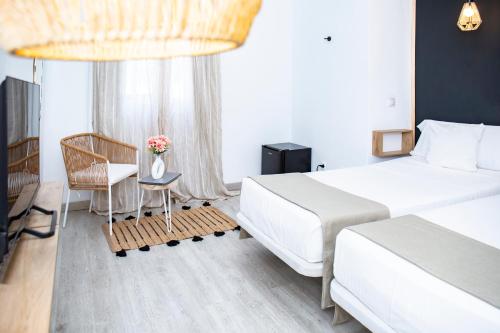 Ένα ή περισσότερα κρεβάτια σε δωμάτιο στο Hotel Casa Dalia