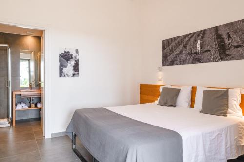 Letto o letti in una camera di Bio Agriturismo Corte degli Ulivi