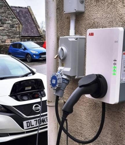 a car is hooked up to a wall at Bryn Derwen in Caernarfon