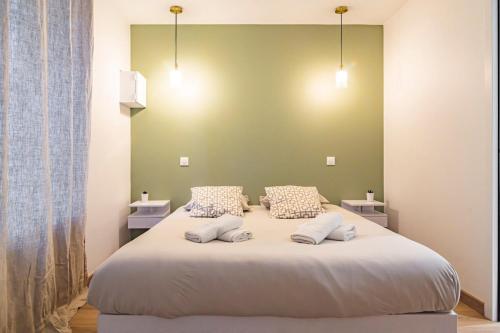 Postel nebo postele na pokoji v ubytování La Suite rue Noël