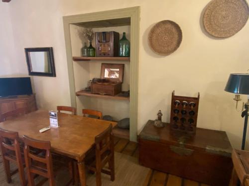 a dining room with a table and chairs and a fireplace at CASONA SAN PEDRO Hotel Boutique in San Javier