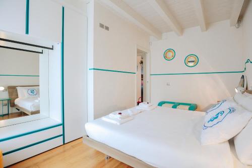 Ένα ή περισσότερα κρεβάτια σε δωμάτιο στο SG Family - Sunset Home