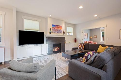 a living room with a couch and a fire place at Hillside Haven in Bend